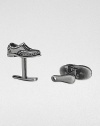 If the shoe fits, wear it on your sleeve with these sterling silver and black rhodium cuff links.Sterling silverShoe horn-shaped backAbout .87 diam.Made in USA