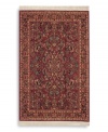 Richly detailed and deeply colored, the exotic floral motif of this rug made its debut in twentieth-century America and has remained a favorite. Individual skein-dyeing imparts a jewel-tone clarity to the rich red, green and ivory palette. A patented wash process creates a soft vintage finish faithful to the craftsmanship of the original. Woven in the USA of premium fully worsted New Zealand wool.