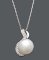You will be absolutely enamored with the timeless elegance of a simple pearl. A cultured South Sea pearl (13-14 mm) suspended from a 14k white gold setting and chain is highlighted by sparkling round-cut diamonds (1/3 ct. t.w.). Approximate length: 18 inches. Approximate drop: 1 inch.
