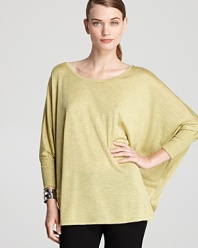Make space in your fashion repertoire for this Eileen Fisher top, flaunting a fluid silhouette and dolman sleeves for easy elegance.