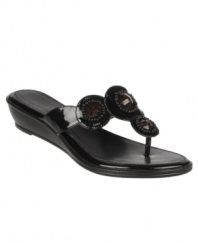 The Etienne Aigner Bacia Sandals add a little twinkle to your looks with their beaded straps and versatile wedge heel.