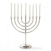 A new heritage piece for your family, this classic and elegant menorah is crafted from Christofle silver.
