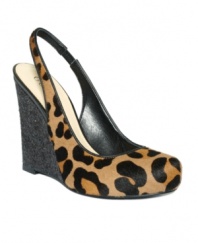 Bust out your party dress with the Russole slingback wedges by GUESS. The on-trend leopard print and sky-high wedges are smoking hot.