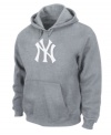 On top of your game. Give it up for the hometown heroes in this New York Yankees hoodie from Majestic Apparel.