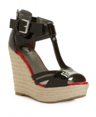 The bolder the better. A contrast footbed lends trendy color blocked appeal to the patent shine of the Talloys wedge sandals from G by GUESS.