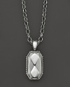 Faceted sterling silver makes a striking statement on a link chain.