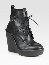 Adjustable, wrap-around buckle strap adds rocker charm to this lace-up leather ankle boot, while a rubber wedge and platform add the right amount of height. Rubber wedge, 5 (125mm)Rubber platform, 1 (25mm)Compares to a 4 heel (100mm)Leather upperLeather liningRubber solePadded insoleMade in Italy