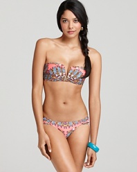 An army of colorful feathers stakes their claim on this vibrant Mara Hoffman bikini.