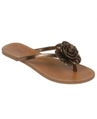 Top off any outfit with the big finish of the Flourish flip flops with their fun floral embellishment, metallic finish and sunny thong styling. By Carlos by Carlos Santana.