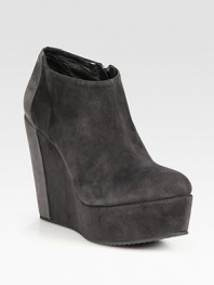 Suede ankle boot in a modern, two-tone design with a self-covered wedge and an exposed side zipper. Self-covered wedge, 5 (125mm)Covered platform, 1½ (40mm)Compares to a 3½ heel (90mm)Suede upperSide zipperLeather liningRubber solePadded insoleMade in ItalyOUR FIT MODEL RECOMMENDS ordering one size up as this style runs small. 