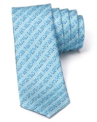 Indulge in the exceptionally soft, textured silk of this fine tie from HUGO, featuring a skinny silhouette for modern appeal and an alluring stripe pattern.