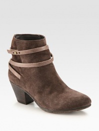 Adjustable leather strap wraps around this butter-soft suede ankle boot while a stacked heel adds a touch of height. Stacked heel, 2½ (65mm)Suede and leather upperLeather lining and solePadded insoleImported