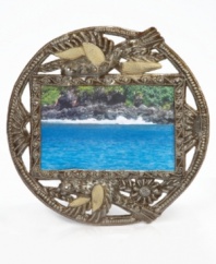 Joyful birds take flight in the hands of Haiti's skilled metalwork artists, who cut, hammer and varnish raw, recycled steel into the amazingly detailed and delicately crafted Golden Bird picture frame.