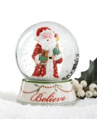 Santa Claus and a sweet teddy bear get in the spirit in this beautifully crafted Believe snow globe, featuring mistletoe and cranberry garland and a flurry of sparkles from Spode.