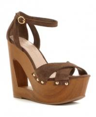 Make the cut: Jessica Simpson's Niki wedge sandals take your style in a fierce direction with stunning cut-out detail at the heel and platform.