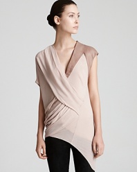 Asymmetric details and supple leather meet for standout modernity on this sheer Helmut Lang top, a must have for the fashion-forward dresser.