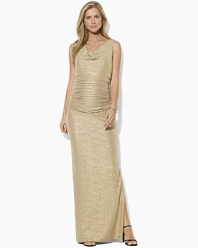 A draped cowl neckline imparts chic, sophisticated style to an elegant evening gown, tailored from softly crinkled jersey with glistening metallic specks for an eye-catching appeal.