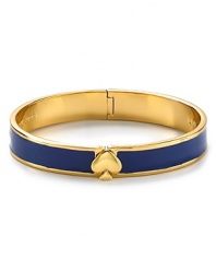 A sweetly simple 12-karat gold plated bracelet gets a lesson in bold style from kate spade new york. This bangle flaunts the brand's signature motif, with a cool touch of color.