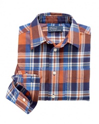 A classic button-front design is given a casual makeover in an eye-catching buffalo check pattern.