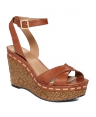 From day to night in the blink of an eye. The Raven sandals by Vince Camuto are perfect at any time with their woven wicker wedge and wraparound ankle strap with dainty buckle.