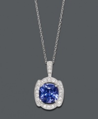 Steal the show with a little statement-making sparkle. B. Brilliant's stunning pendant highlights a Tanzanite-colored cubic zirconia  (7 ct. t.w.) encircled by sparkling clear cubic zirconias (5/8 ct. t.w.). Crafted in sterling silver. Approximate length: 18 inches. Approximate drop: 1 inch.