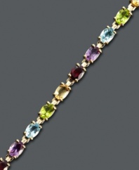 Spice up your look with a myriad of colors. Victoria Townsend's playful bracelet style highlights oval-cut garnet (4 ct. t.w.), amethyst (2-1/2 ct. t.w.), citrine (3-1/4 ct. t.w.), peridot (2-3/4 ct. t.w.), and blue topaz (3-1/4 ct. t.w.). Crafted in 18k gold over sterling silver. Approximate length: 7 inches.