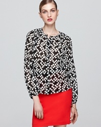 Rendered in luxe stretch silk, this graphic-print Trina Turk top is a bold yet ladylike addition to your work portfolio.