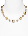 Carolee's necklace with alternating plain and pave beads lends a chic, sparkling finish to your look.