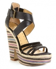 Leave everything out in the open. Eye-catching cutouts in rich leather set apart the stylish Treston wedge sandals by Nine West. Finished with a wedge woven with colorful detail, for added flair. (Clearance)