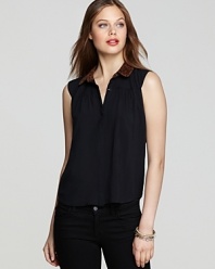 This DV Dolce Vita sleeveless button-up top is boldly punctuated by a leopard-print collar for a hint of the exotic.