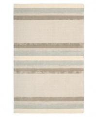 Linear designs are accented with exotic faux silk to create a timeless palette in the Sahara area rug from Calvin Klein. Crafted by skilled artisans in India, it features generously thick wool and viscose fibers woven to create remarkable strength and impeccable elegance.