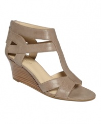 The summer's hottest silhouette. With a T-strap at the vamp and zipper at back, the Pipin Hot sandals by Nine West are the perfect wear-everywhere wedges.